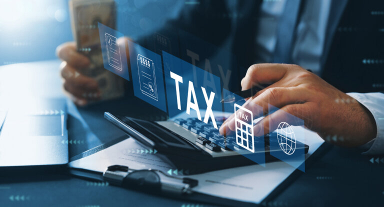 Business person fill in the income tax return form