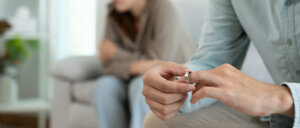 Man remove married ring.